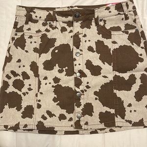 Cow print denim front button skirt. New with tags!